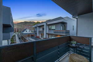 Balcony at dusk with a mountain view