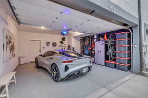The garage is impeccably organized, clean, with high-quality finish on the concrete