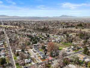Birds eye view of property featuring a mountain view and a residential view