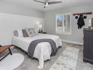 Primary Bedroom featuring visible vents, baseboards, a ceiling fan, and carpet flooring