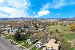 Drone / aerial view featuring a mountain view and a residential view