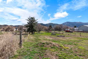 Property view of mountains with a rural view