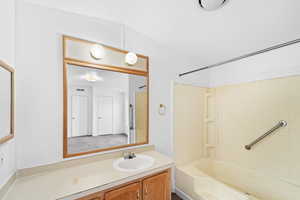 Full bathroom featuring vanity and bathing tub / shower combination