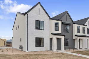 View of front of property with brick siding