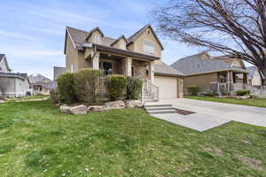 View of front of home with concrete driveway, covered porch, a garage, and stucco siding