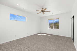 Unfurnished bedroom with recessed lighting, carpet, visible vents, and baseboards