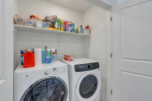 Laundry room with laundry area and washing machine and clothes dryer