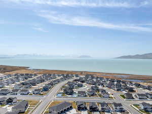 Aerial view with a water and mountain view and a residential view