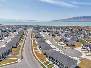 Aerial view featuring a water and mountain view and a residential view