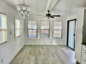 Interior space featuring visible vents and an inviting chandelier