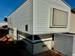 View of property exterior featuring central AC unit