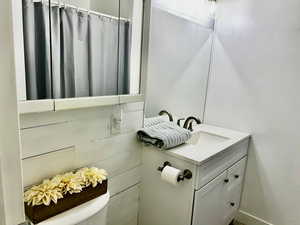 Bathroom featuring vanity and toilet