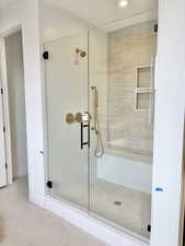 Full bath featuring a shower stall and recessed lighting