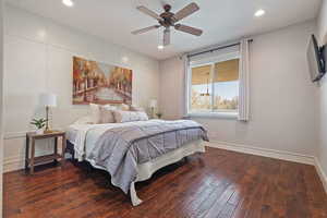 Primary bedroom featuring recessed lighting, hardwood flooring, and ceiling fan