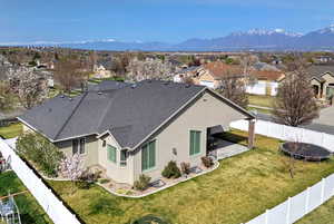 Birds eye view of property with a mountain view and a residential view