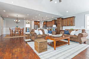 Family room featuring with ceiling fan, wood flooring, vaulted ceiling, and recessed lighting