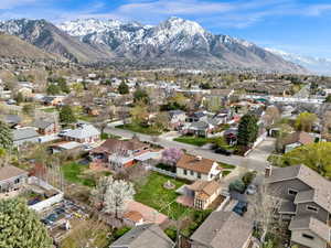 Birds eye view of property with a mountain view and a residential view