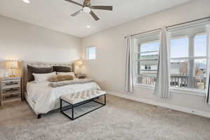 Carpeted bedroom featuring ceiling fan, baseboards, visible vents, and recessed lighting
