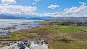 Aerial view featuring a water and mountain view