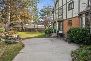 View of patio featuring fence