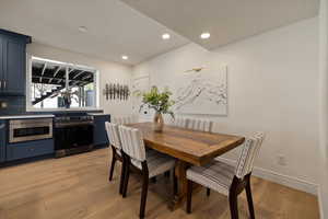 Dining area featuring light wood-style flooring, recessed lighting, and baseboards