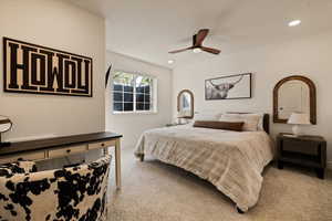 Bedroom with baseboards, recessed lighting, and light carpet