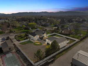 Birds eye view of property with a residential view and a mountain view