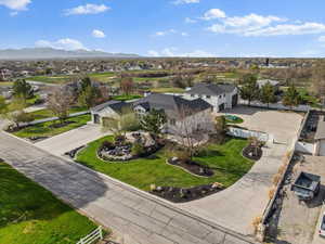 Birds eye view of property with a mountain view and a residential view