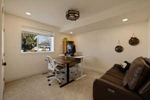 Office area featuring baseboards, recessed lighting, and carpet