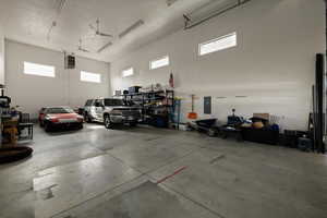 Garage with electric panel and a garage door opener