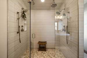 Full bathroom featuring a shower stall