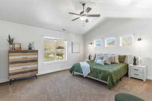 Primary Bedroom with vaulted ceilings, attached bedside lighting, and a ceiling fan