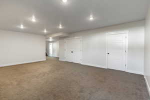 Living room featuring storage closet and utility room (Double doors).