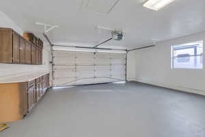 Garage has painted floor and lots of storage