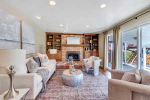Family room opens to kitchen  andhas beautiful fireplace and built-in shelving
