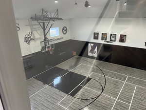 View of basketball court featuring full-size basketball court