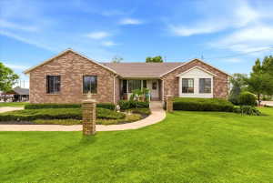 Brick facade residence with a gabled roofline