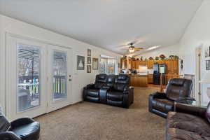 Living area with vaulted ceilings, recessed lighting, and a skylight