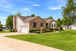 Brick and siding exterior with a pitched roof