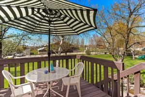 Spacious outdoor deck with brown wood-finish decking and railings