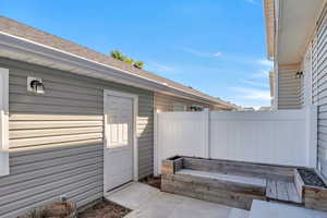 View of patio with fence