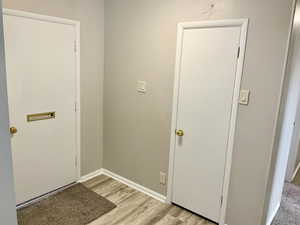 Entryway featuring light wood-style flooring and baseboards