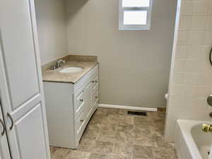 Bathroom with visible vents and vanity