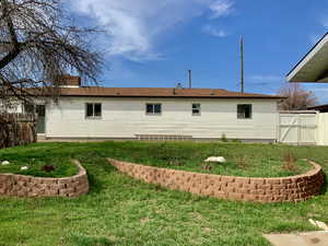 Back of house with a gate