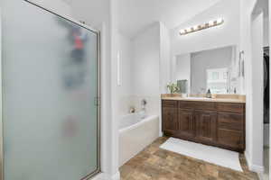 Master bath with tub and shower.