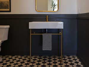 Interior details featuring toilet and a sink