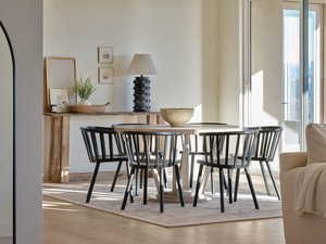 Dining space featuring plenty of natural light and wood finished floors