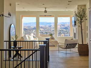 Interior space featuring ceiling fan and wood finished floors