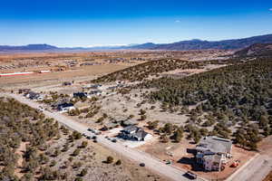 Bird's eye view featuring a rural view, a mountain view, and view of desert