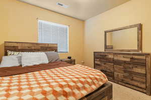 Bedroom with visible vents